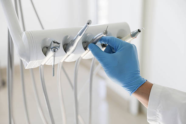 Professional Tooth Extraction technician working in Peoria, IL